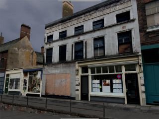 More information about "Semi derelict shops"