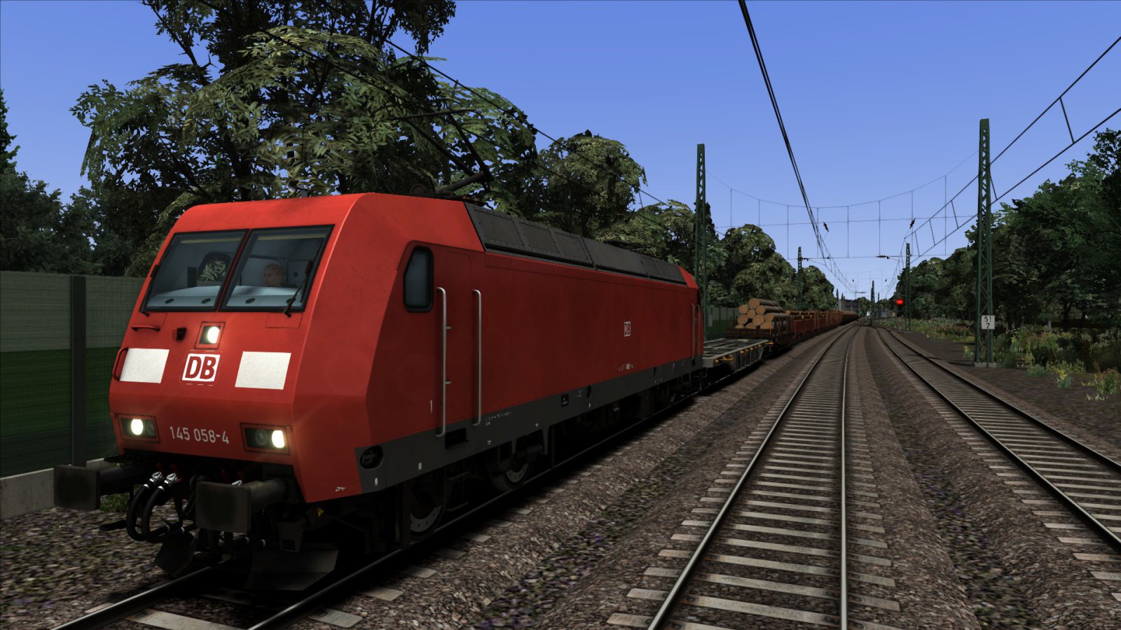 BR 145 met houttrein op de Hamburg-Lübeck lijn